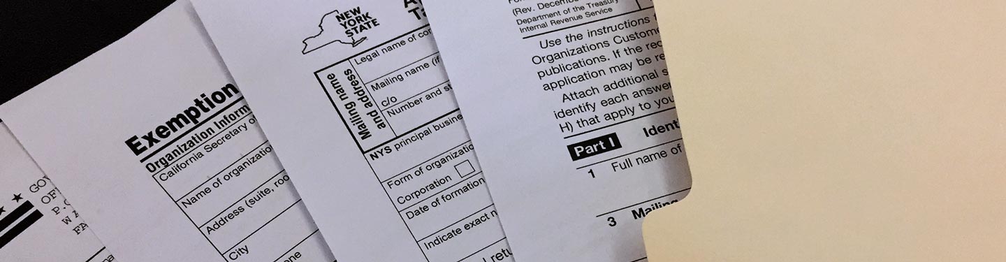 A spread of various state forms in a folder