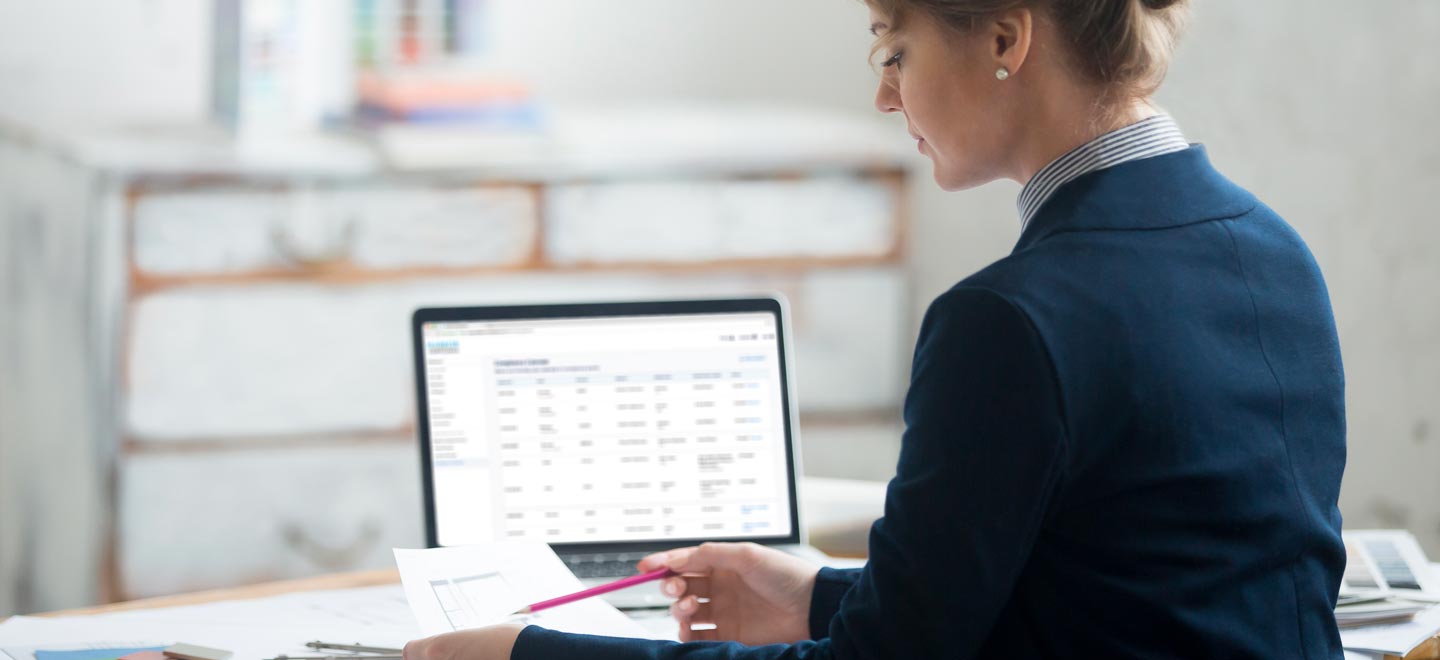 A young woman checking her compliance reports