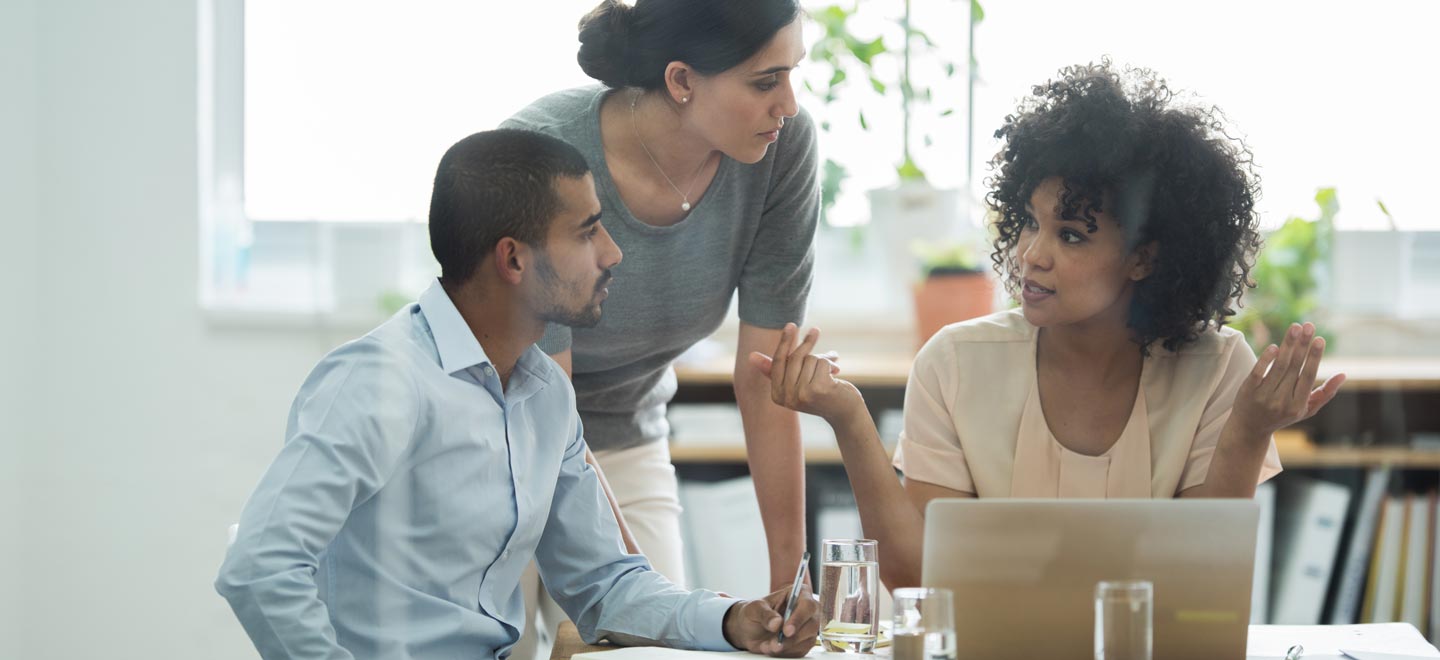 A team of young professionals discussing fundraising strategies