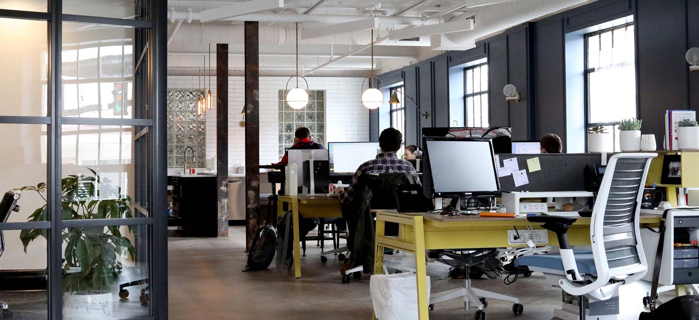 A view of a small office with desks and computers